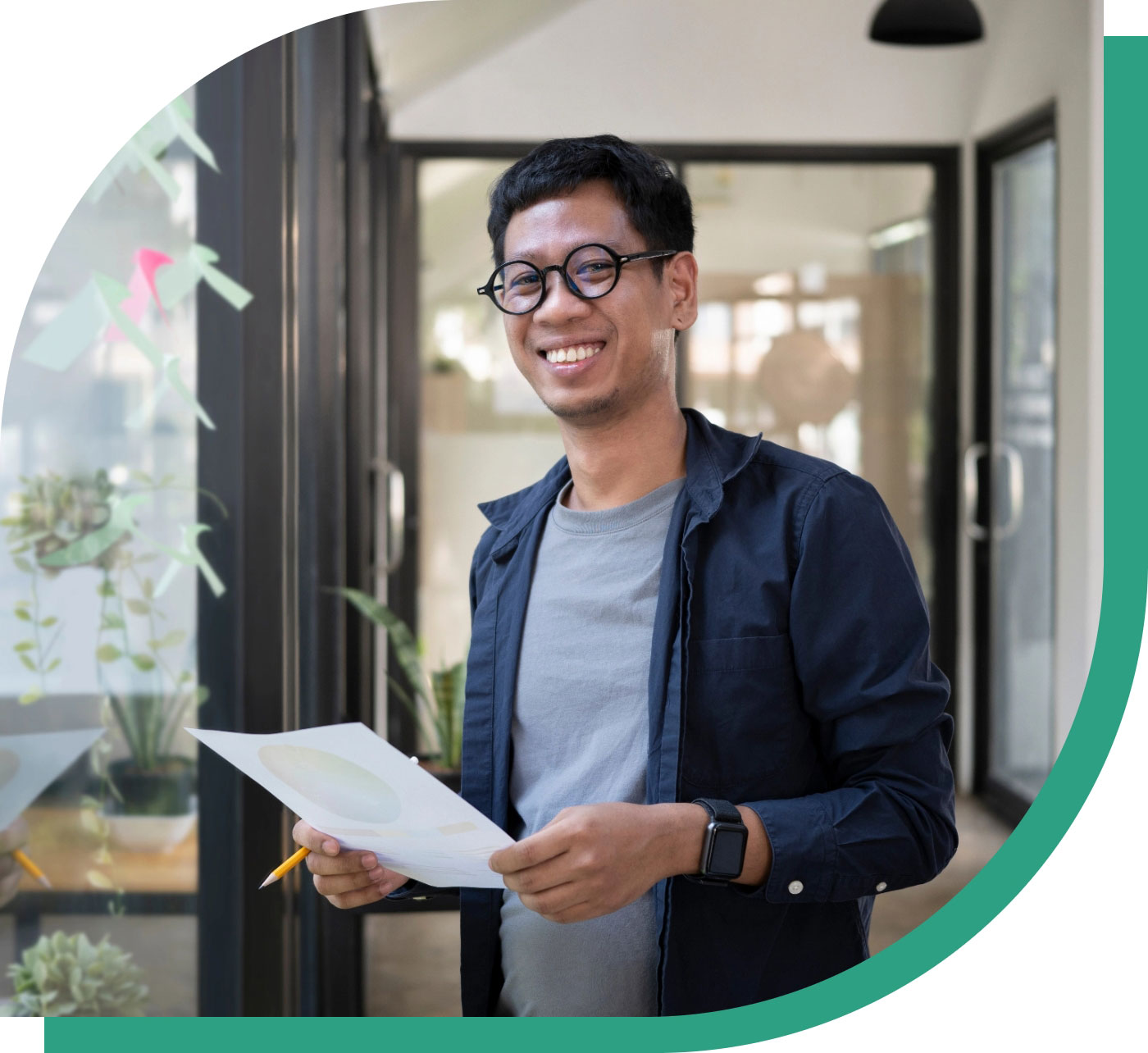 Smiling erson with paper in hand