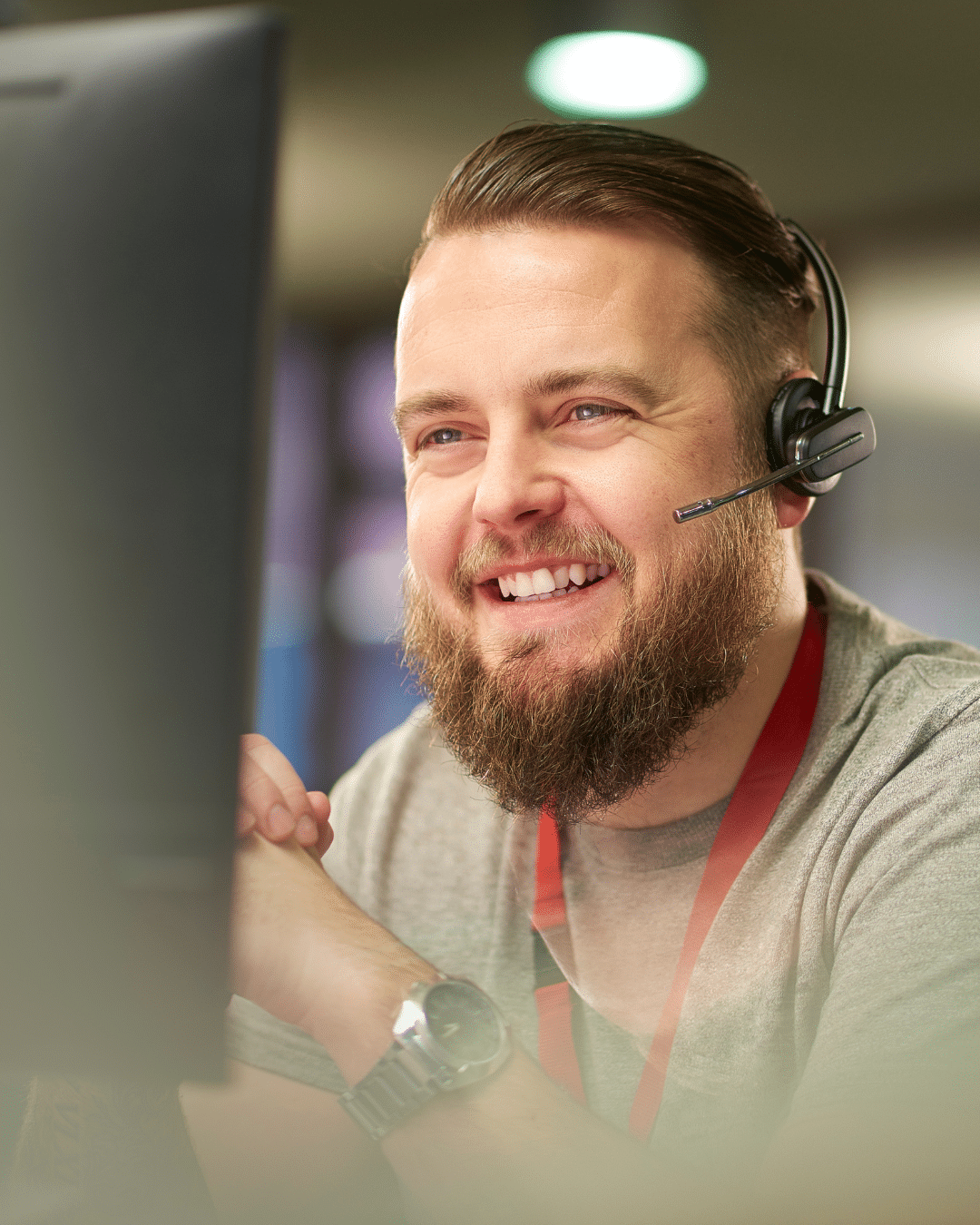 PCe Solutions Calgary IT support technician smiling while assisting a client