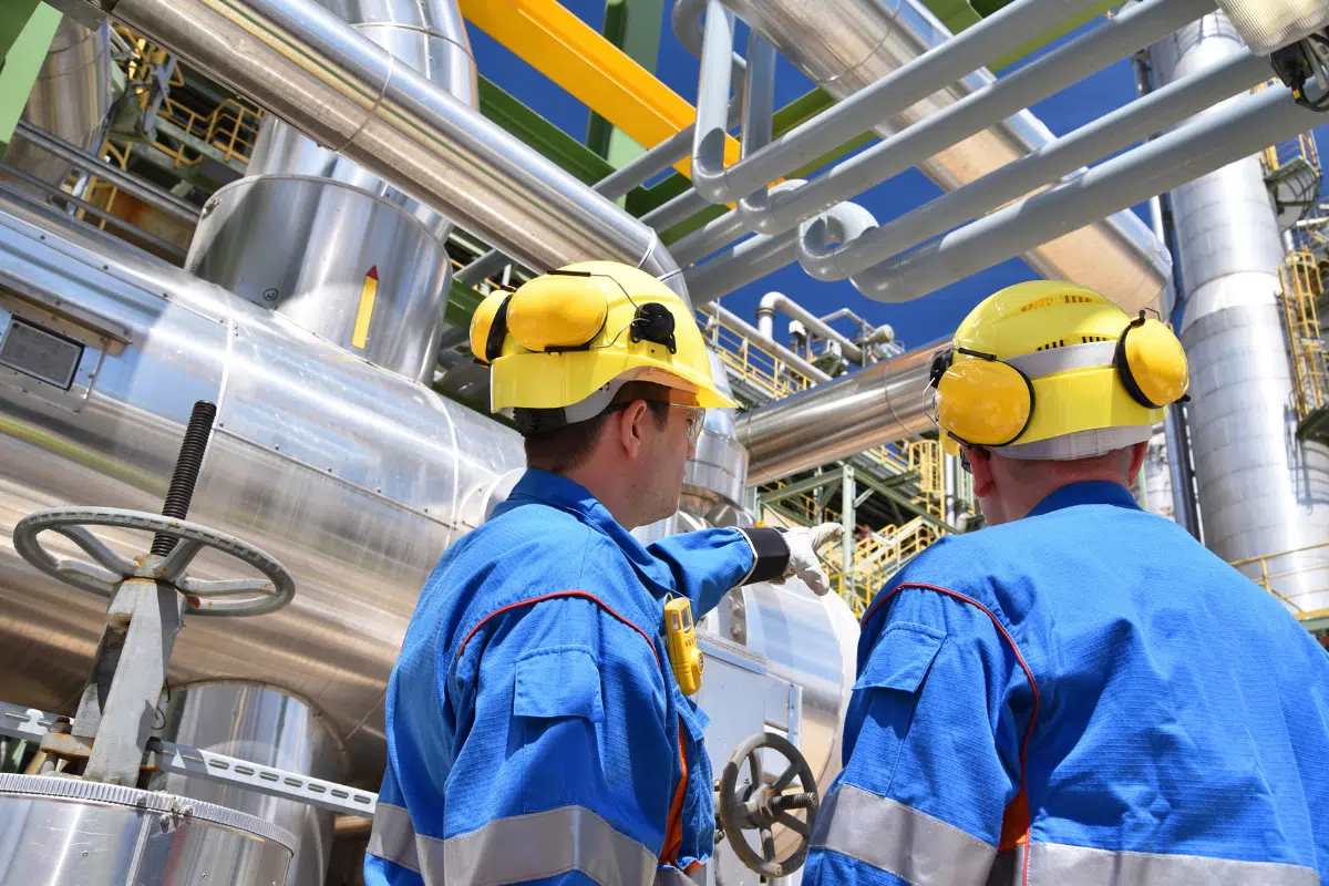 Calgary oil and gas workers in industrial facility requiring IT infrastructure support by PCe Solutions