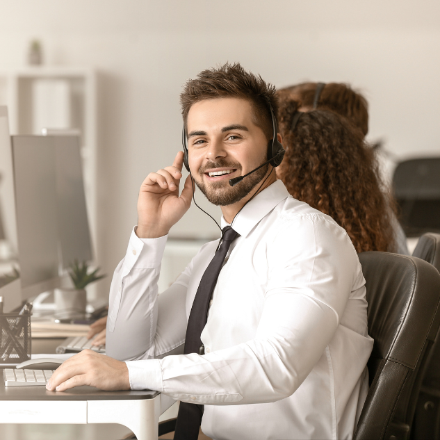 Help Center 1 Man wearing head set smiling. Help Center.