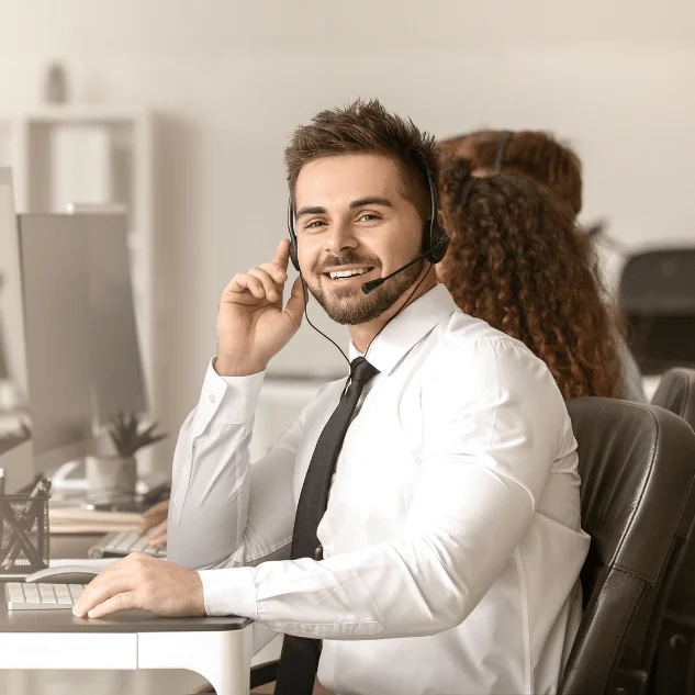 Man wearing head set smiling. Help Center.