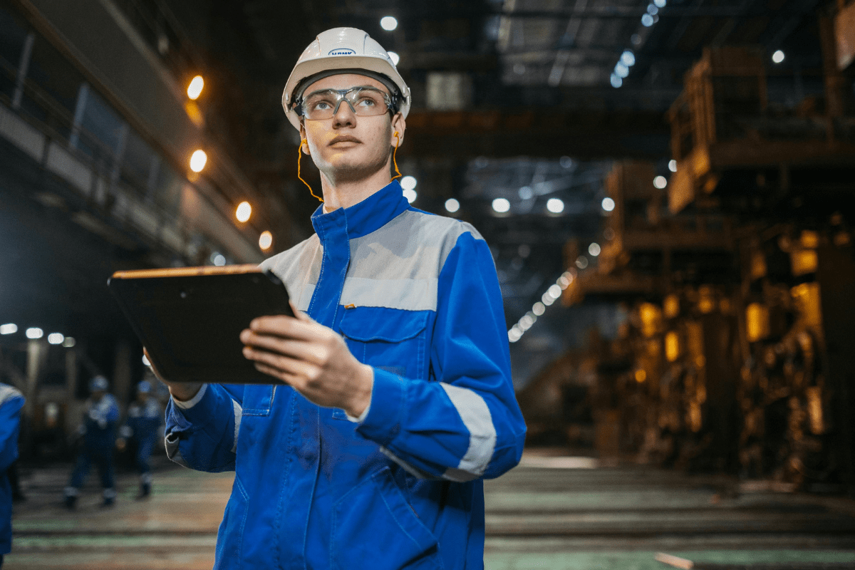 Tampa aerospace and industrial facility worker in safety gear representing the specialized IT infrastructure and cybersecurity support PCe Solutions provides to Tampa Bay's engineering and defense sectors