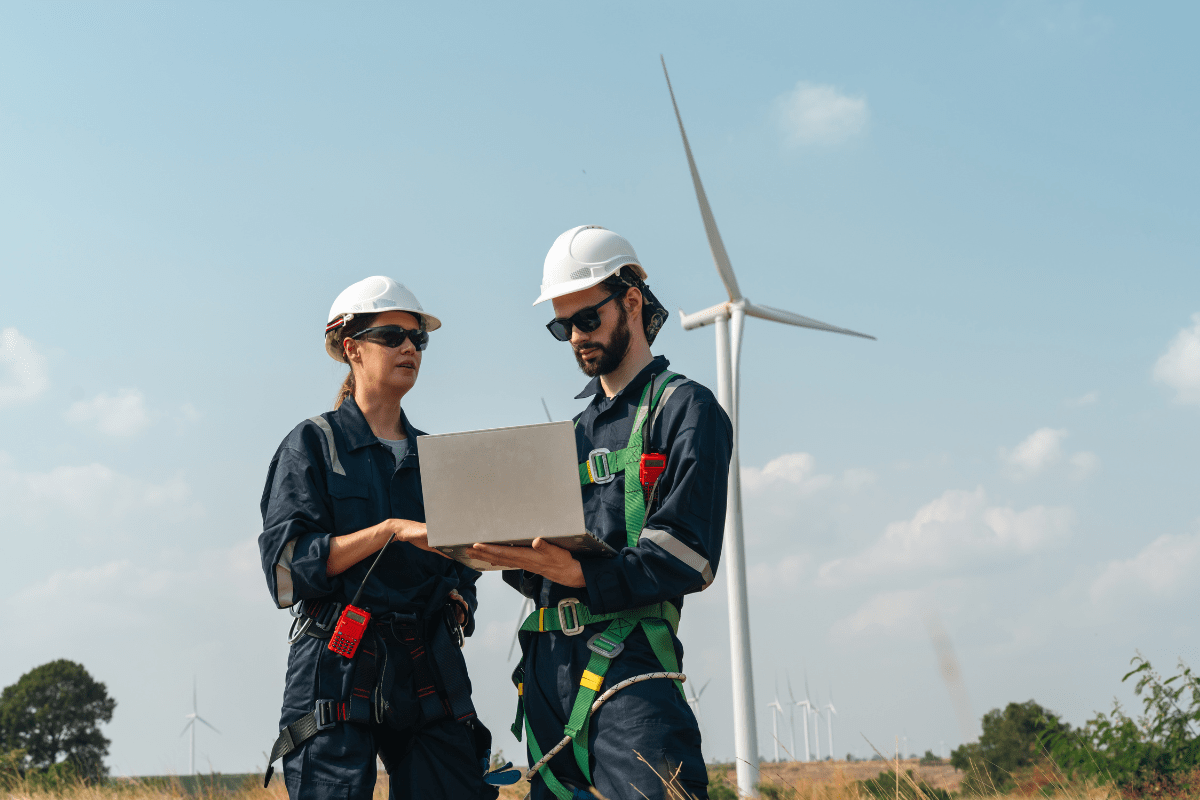 Calgary energy or engineering professional reviewing technical data with AI-assisted tools at a workstation representing PCe Solutions Managed Intelligence AI services for Calgary energy and engineering firms across Alberta