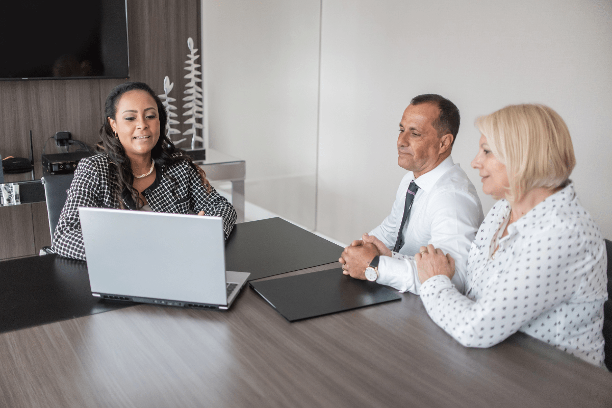 Calgary financial advisor confidently reviewing AI-powered predictive client intelligence dashboard provided by PCe Solutions Managed Intelligence AI services for Calgary financial services firms across Alberta
