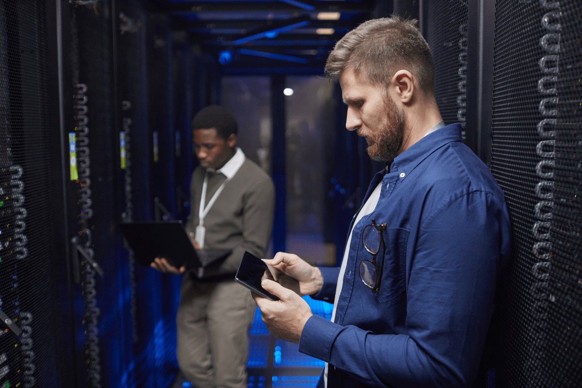 IT support professional working on-site at a Calgary business server room or office environment representing PCe Solutions hands-on local IT support services for organizations across Calgary and Southern Alberta