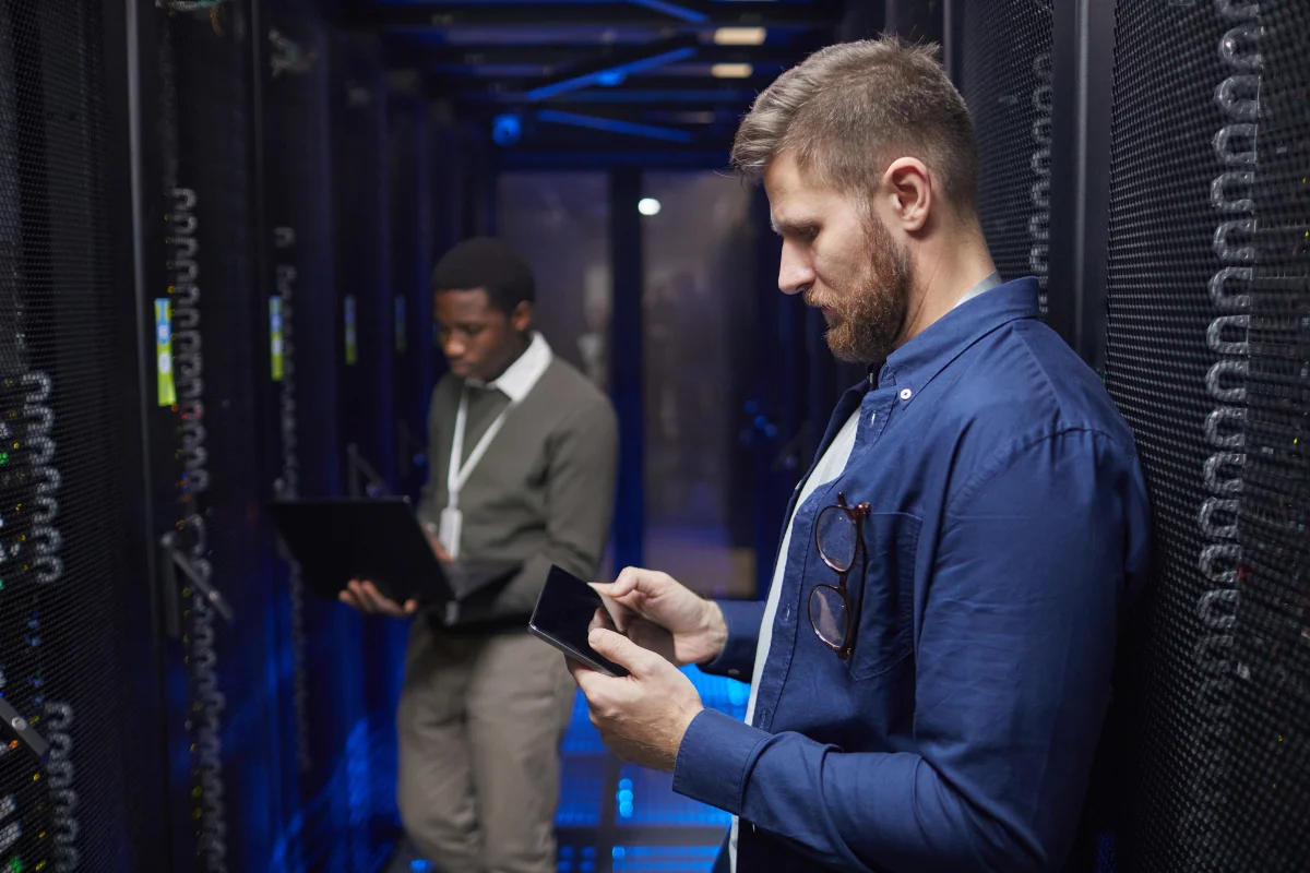 IT support professional working on-site at a Calgary business server room or office environment representing PCe Solutions hands-on local IT support services for organizations across Calgary and Southern Alberta