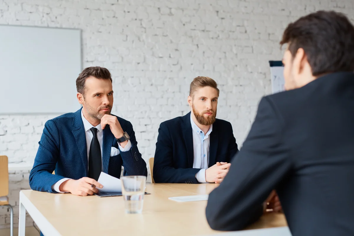 Calgary IT professional reviewing cloud architecture and migration planning on a large monitor in a modern office environment representing PCe Solutions structured cloud migration management and ongoing cloud services for Calgary Alberta organizations