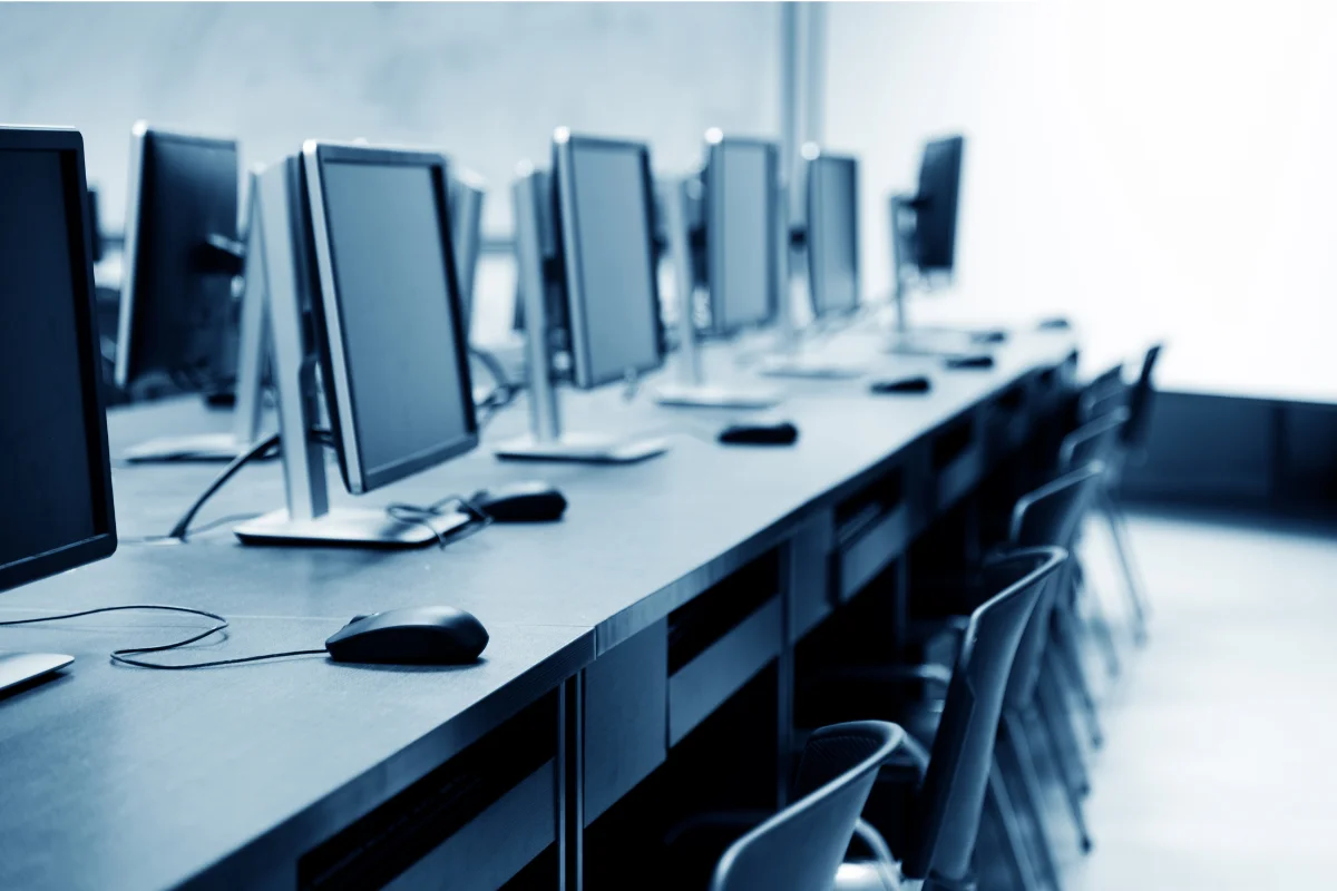 Modern business hardware laptops workstations and networking equipment arranged in a contemporary Calgary office environment representing PCe Solutions Hardware as a Service and IT procurement solutions for Calgary Alberta businesses