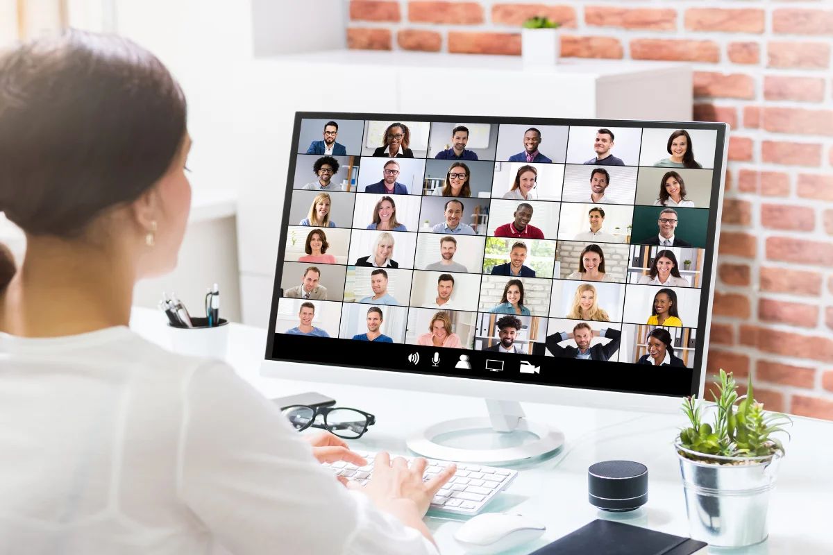 Calgary business professionals engaged in a video call using unified communications tools in a modern Downtown Calgary or Quarry Park office environment representing PCe Solutions VoIP and unified communications deployment services for Alberta businesses