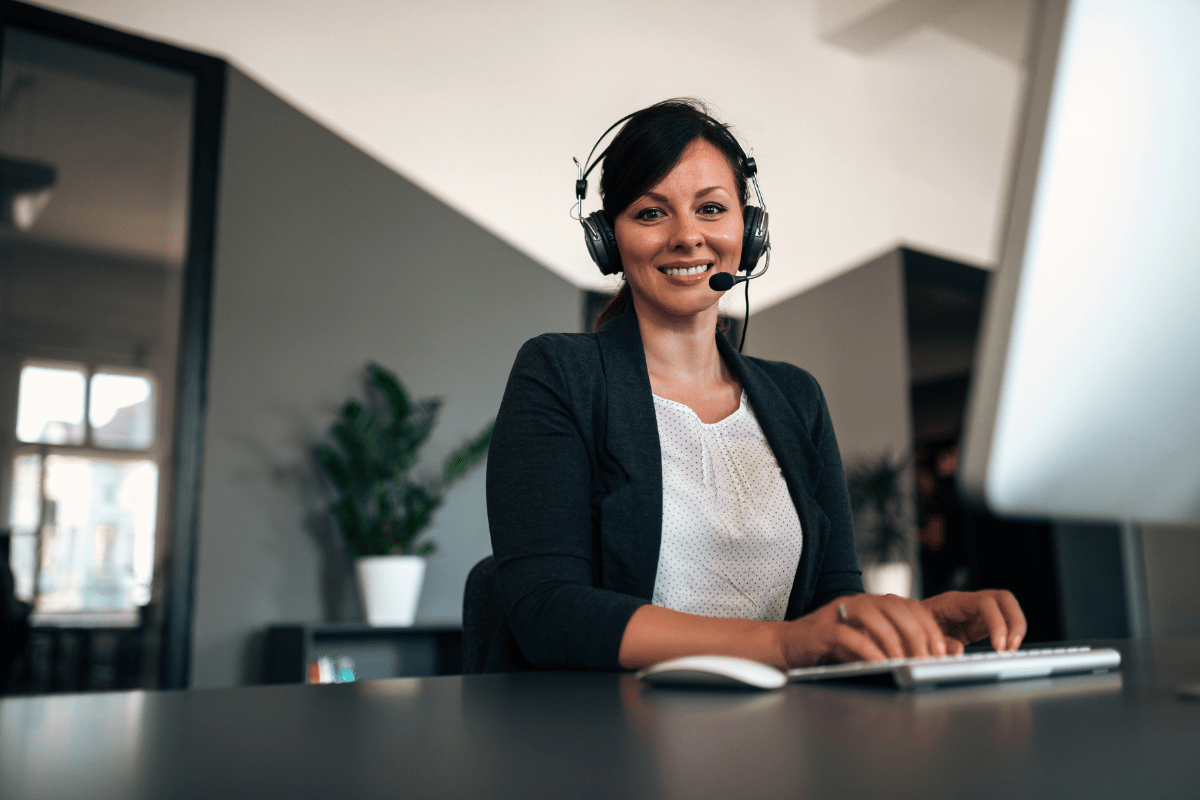 Calgary IT support professional actively resolving a business technology issue at a helpdesk workstation with multiple screens representing PCe Solutions 24/7 local IT support and helpdesk services for Calgary Alberta businesses across the Downtown Core Beltline Quarry Park and NE Calgary