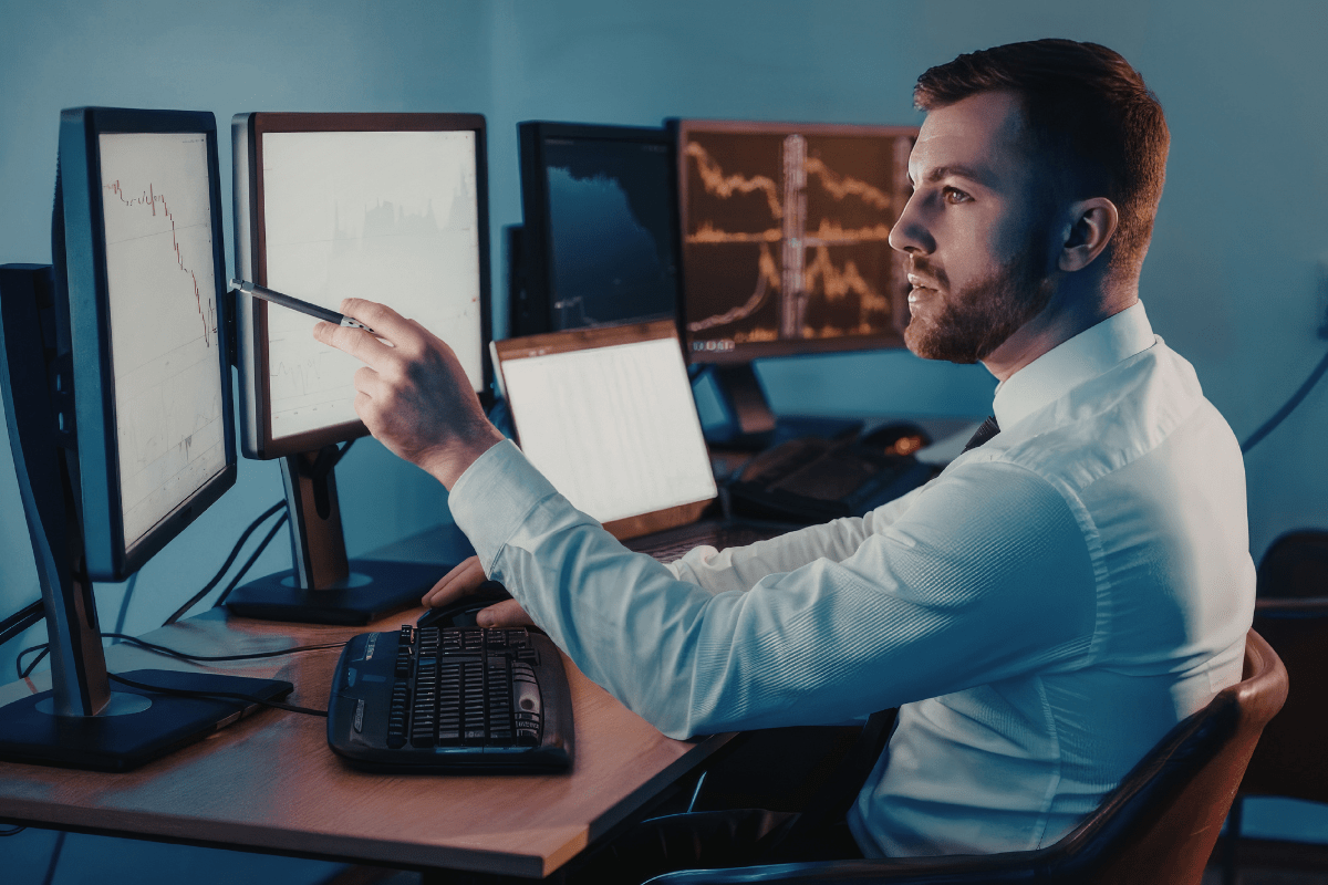 Calgary business professional reviewing cybersecurity compliance documentation and security posture report in a professional office environment representing PCe Solutions cybersecurity compliance support for financial services healthcare and energy organizations across Calgary Alberta