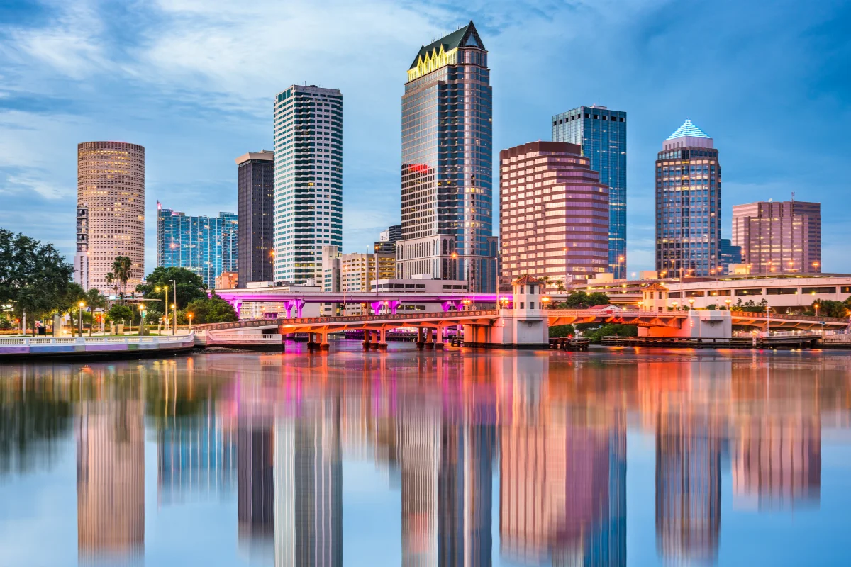 Tampa Florida downtown skyline at dusk reflecting over the Hillsborough River, home base for PCe Solutions local managed IT services and cybersecurity support across the Tampa Bay area