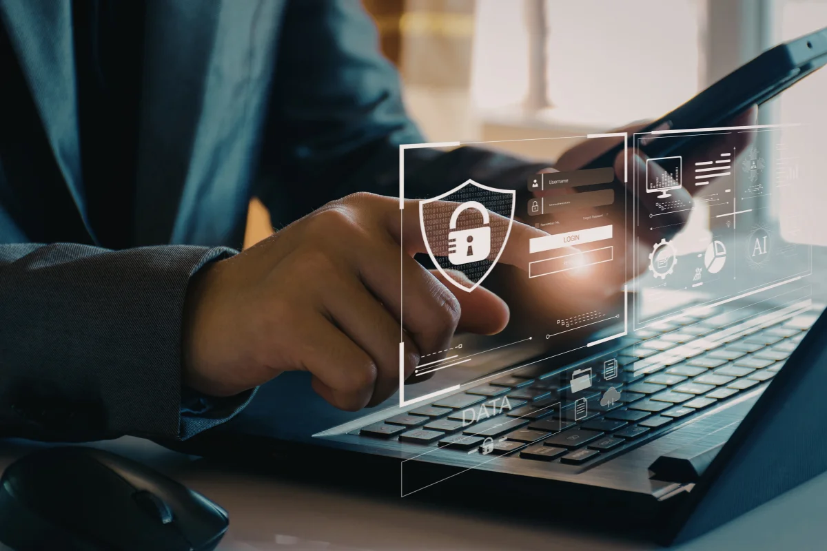 Tampa financial services professional reviewing cybersecurity compliance dashboard on computer monitor representing PCI-DSS and GLBA compliance support provided by PCe Solutions managed IT services across Tampa Bay