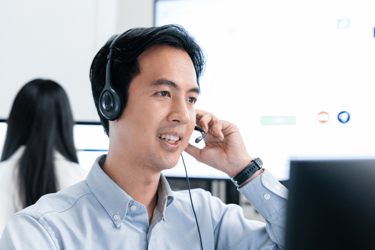 PCe Solutions Tampa IT helpdesk support technician with headset providing local managed IT assistance and fast response times to Tampa Bay area businesses