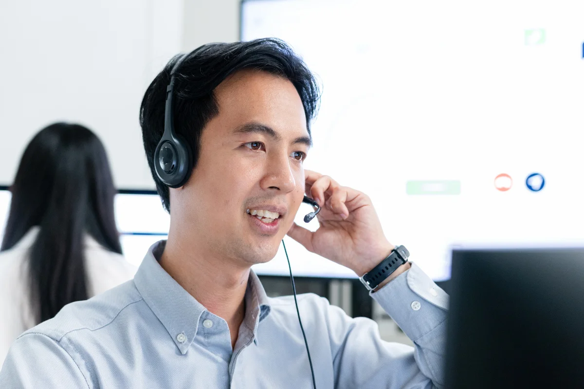 PCe Solutions Tampa IT helpdesk support technician with headset providing local managed IT assistance and fast response times to Tampa Bay area businesses