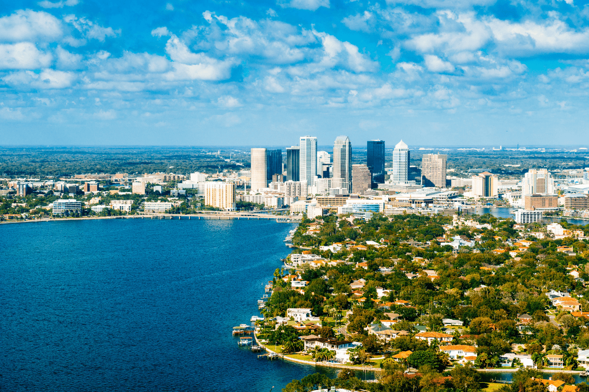 Aerial view of Tampa Bay Florida shoreline with downtown Tampa skyline and South Tampa waterfront neighborhoods visible across the bay, served by PCe Solutions local cybersecurity and managed IT services across the Tampa Bay area