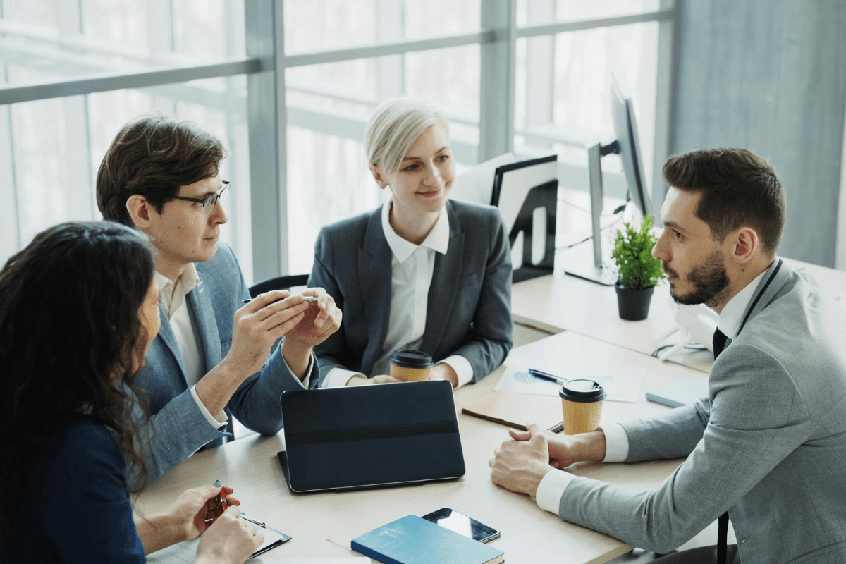 IT consultant meeting with Tampa business professionals to review technology strategy and IT project planning representing PCe Solutions professional IT services for Tampa Bay Florida organizations across healthcare financial services legal and aerospace sectors