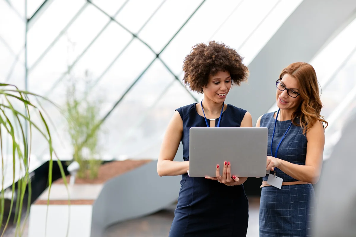 PCe Solutions IT consultant walking a Calgary business owner through a structured technology assessment and roadmap document representing independent IT Consulting and Strategy guidance for businesses across Calgary and Southern Alberta