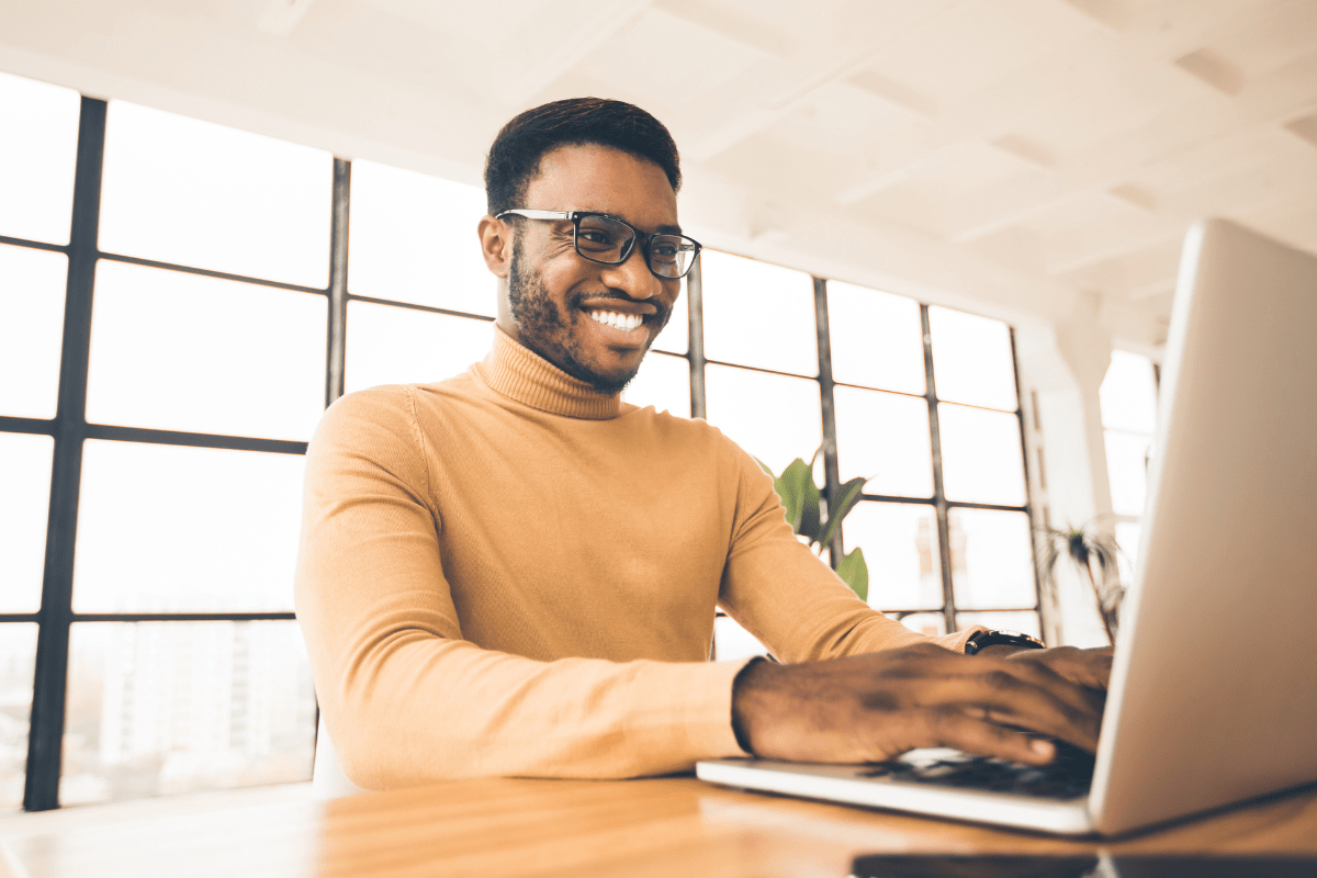 Confident Tampa business professional working productively at a clean well-functioning workstation representing what good managed IT looks like for Tampa Bay Florida businesses across Hillsborough Pinellas and Pasco counties