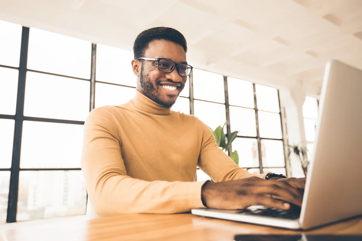 Confident Tampa business professional working productively at a clean well-functioning workstation representing what good managed IT looks like for Tampa Bay Florida businesses across Hillsborough Pinellas and Pasco counties
