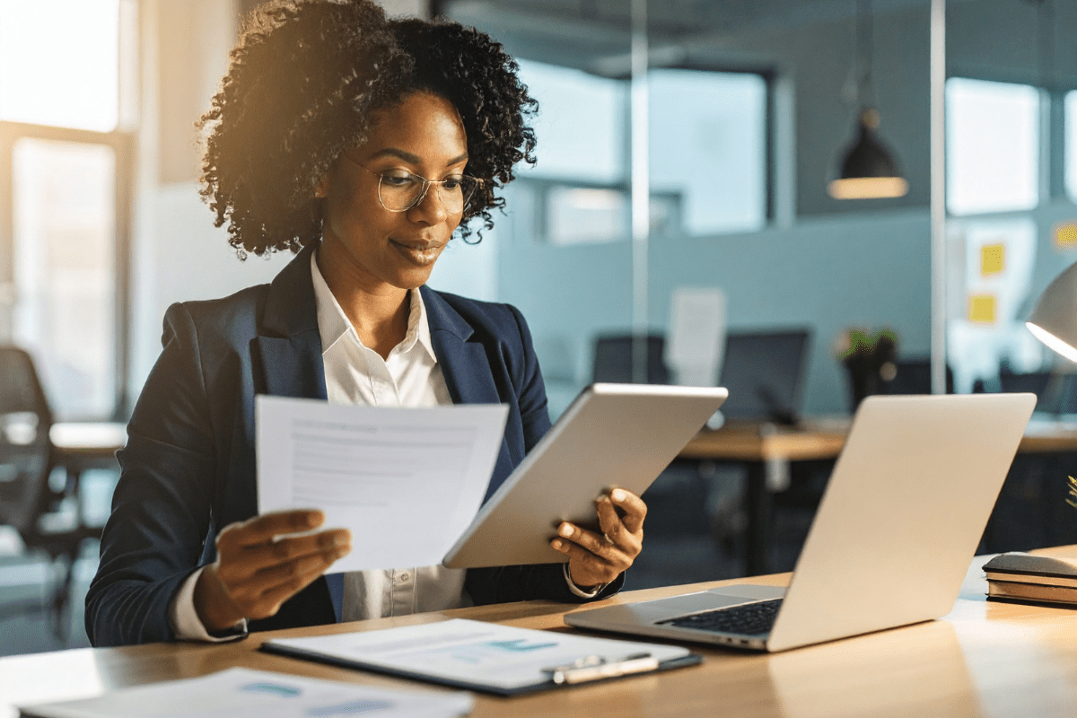 Cyber insurance Calgary business owner reviewing an insurer security questionnaire and required controls checklist representing PCe Solutions cybersecurity readiness services across Alberta