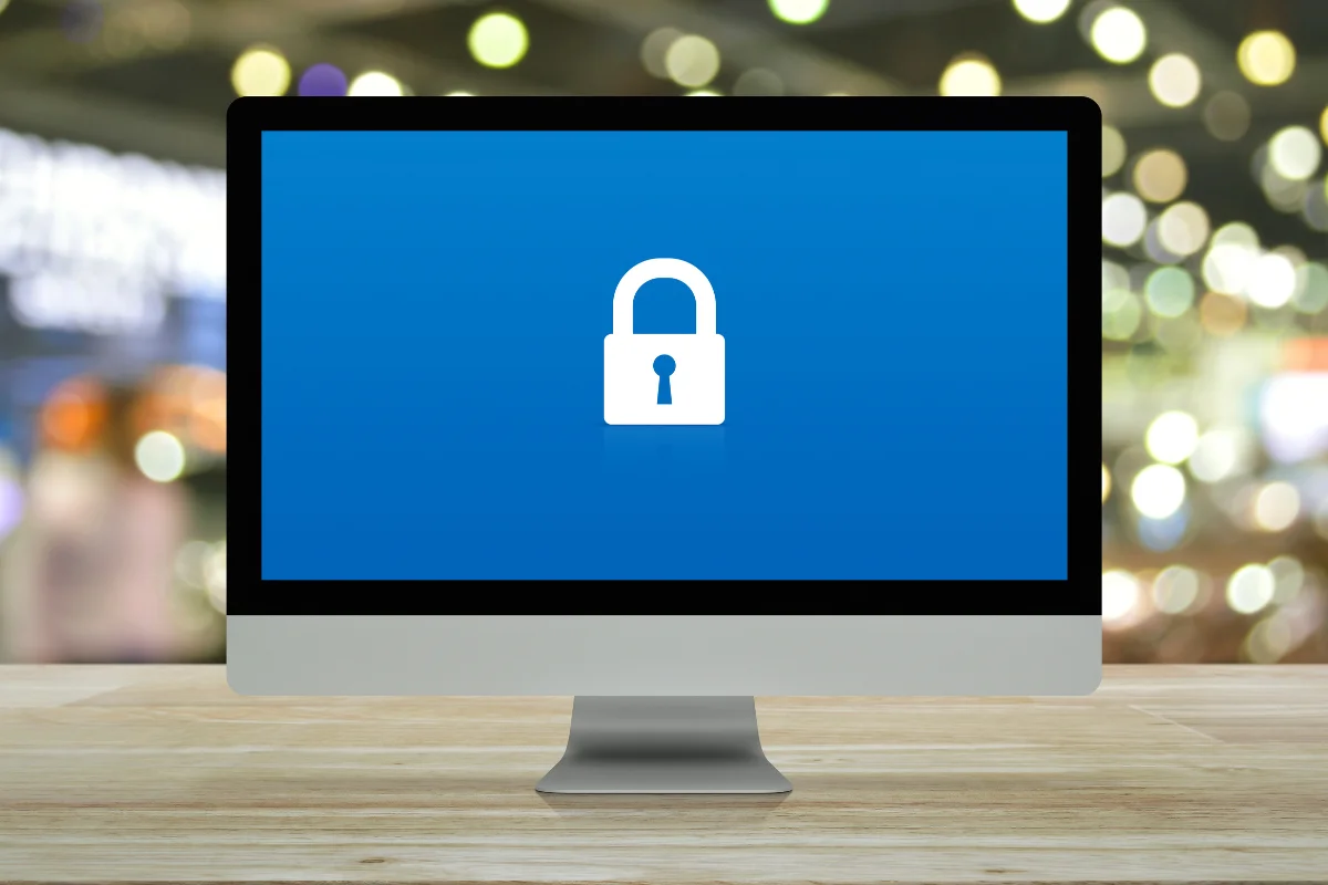 Ransomware attack Calgary business owner responding to a locked computer screen and ransom note representing PCe Solutions incident response and cybersecurity services across Alberta